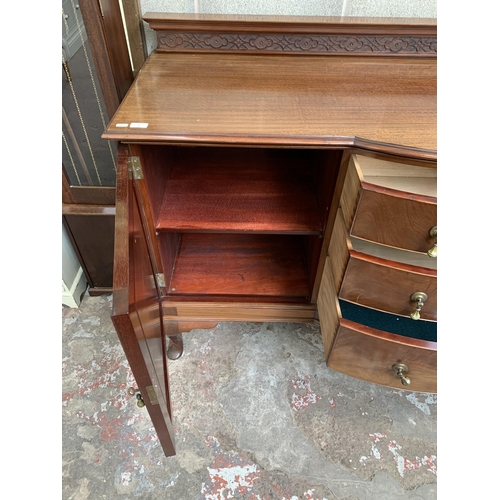 9 - An Edwardian carved mahogany bow fronted sideboard on cabriole supports - approx. 110cm high x 182cm... 