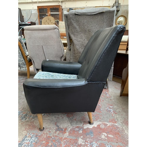 96 - A mid 20th century black vinyl upholstered armchair with floral cushion - approx. 92cm high x 80cm w... 