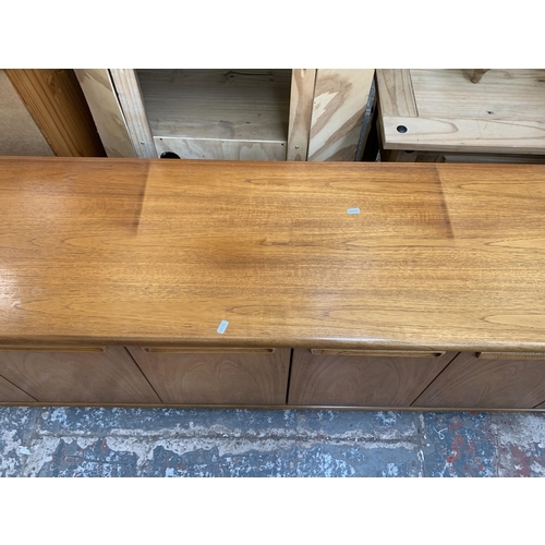 61 - A mid 20th century teak sideboard - approx. 58cm high x 200cm wide x 45cm deep