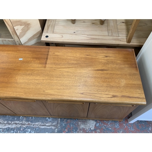 61 - A mid 20th century teak sideboard - approx. 58cm high x 200cm wide x 45cm deep