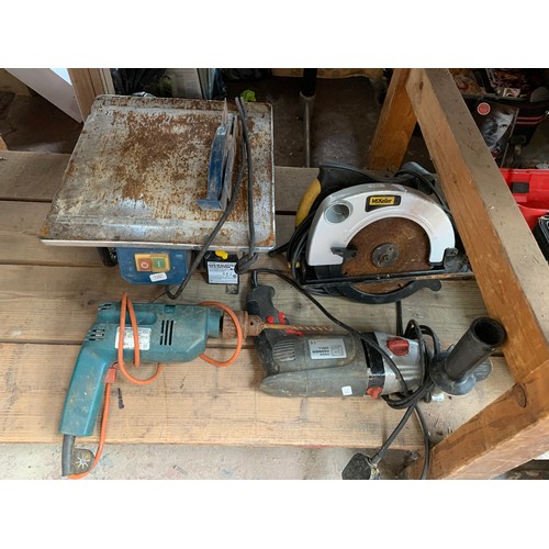 984A - A collection of tools to include Hilti breaker, McKeller circular saw, Workzone 600w tile cutter etc... 