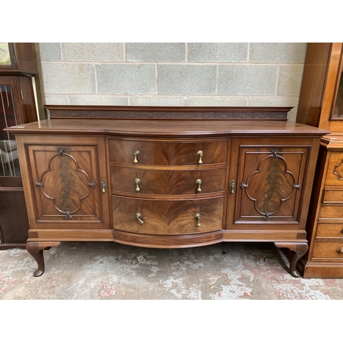 6 - An Edwardian carved mahogany bow fronted sideboard on cabriole supports - approx. 110cm high x 182cm... 