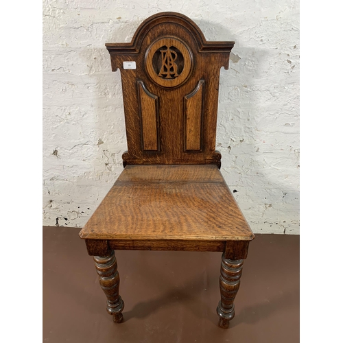 8 - A 19th century carved oak hall chair - approx. 89cm high x 43cm wide x 37cm deep