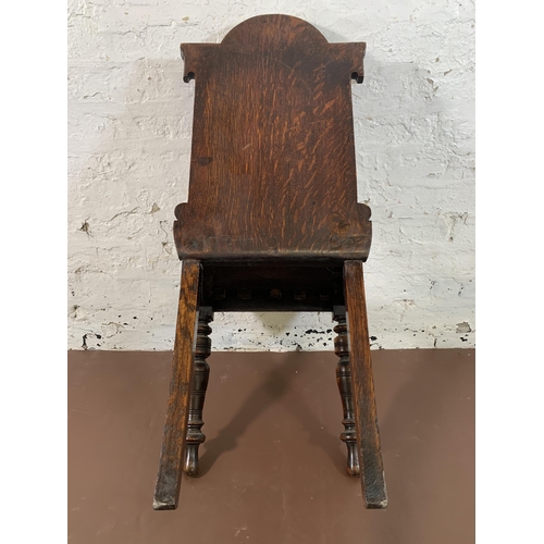 8 - A 19th century carved oak hall chair - approx. 89cm high x 43cm wide x 37cm deep