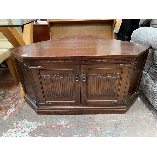 25 - An Old Charm carved oak TV cabinet