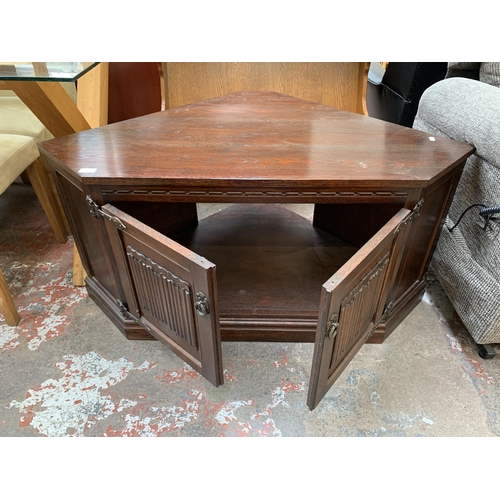 25 - An Old Charm carved oak TV cabinet