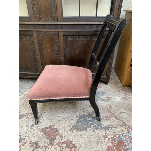 26 - Two late 19th/early 20th century items, one ebonized and fabric upholstered bedroom chair on castors... 