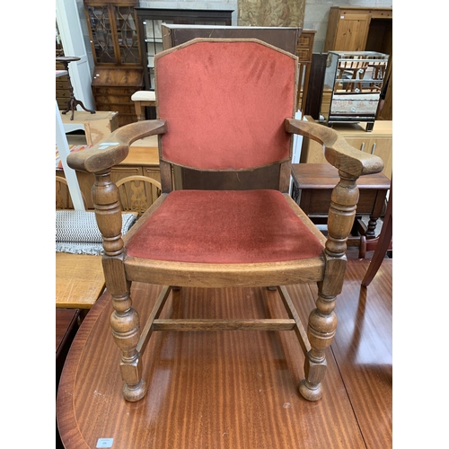 104 - A mid 20th century Harrops Better Furniture oak and fabric upholstered armchair