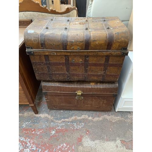 142 - Two early 20th century brown metal travel trunks