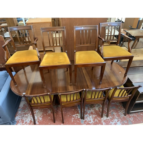 199 - A Georgian style mahogany D end extending dining table and eight chairs