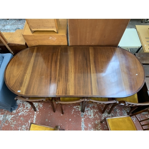 199 - A Georgian style mahogany D end extending dining table and eight chairs