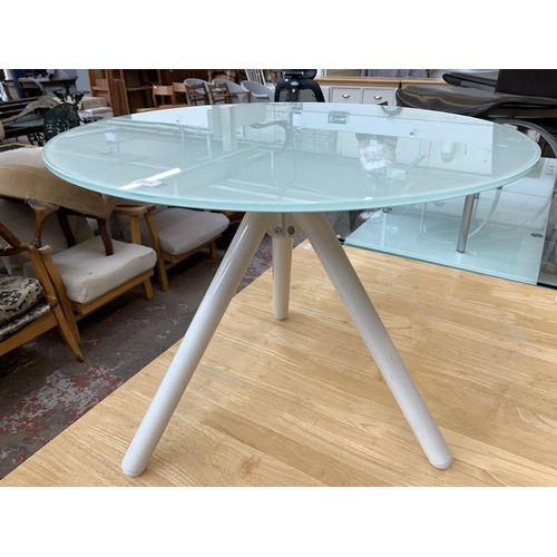 238 - A modern glass top and white metal tripod side table - approx. 50cm high x 60cm diameter