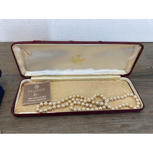 429 - A collection of vintage simulated pearl necklaces with sterling silver clasps