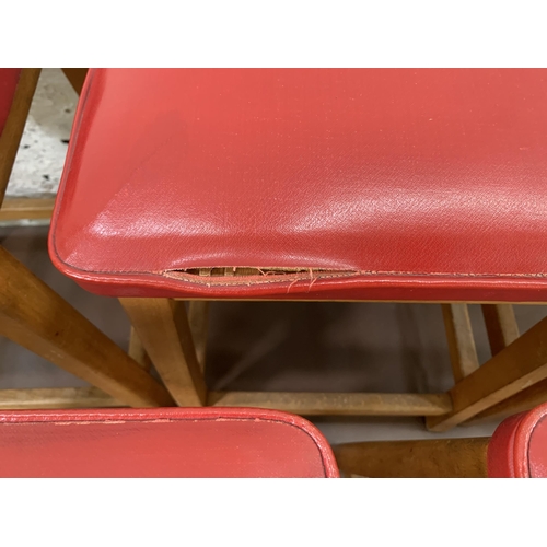 250A - Five mid 20th century beech and red vinyl upholstered stools - approx. 50cm high x 33cm wide x 28cm ... 