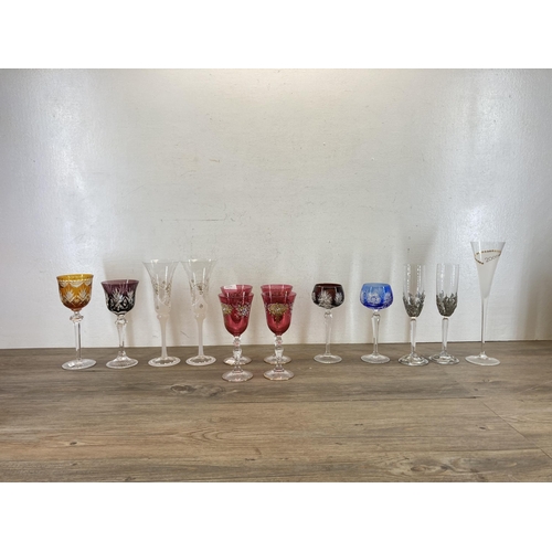 355 - Thirteen pieces of glassware to include to Royal Selangor pewter decorated champagne flutes, four Cz... 