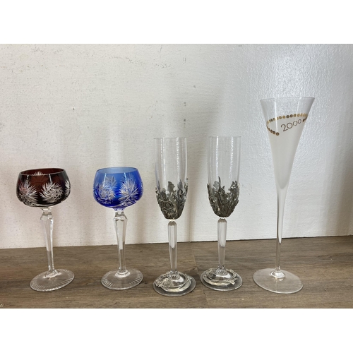 355 - Thirteen pieces of glassware to include to Royal Selangor pewter decorated champagne flutes, four Cz... 