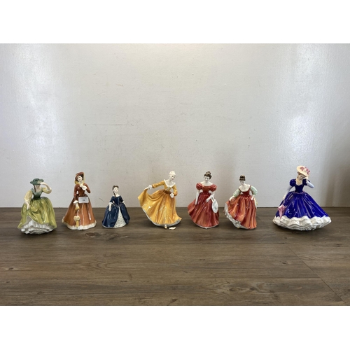 356 - Seven Royal Doulton figurines, Julia - HN2705, Buttercup - HN2309, Debbie - HN2385, Fair Lady (Red) ... 