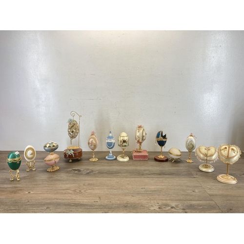 364 - Fourteen decorative egg shaped trinket boxes and ornaments to include Reuge Love Story No. 5517 musi... 