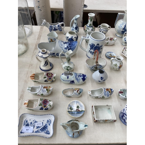 367 - A collection of Delft hand painted ceramics to include jugs, cow creamer, shoe ashtrays etc.