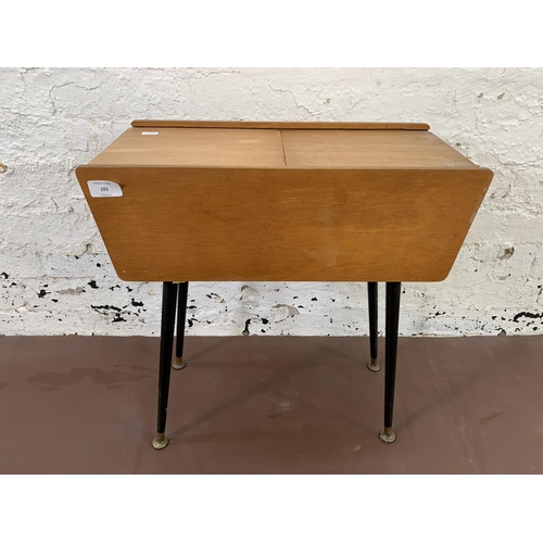 101 - A mid 20th century plywood sewing box on dansette legs - approx. 55cm high x 52cm wide x 24cm deep