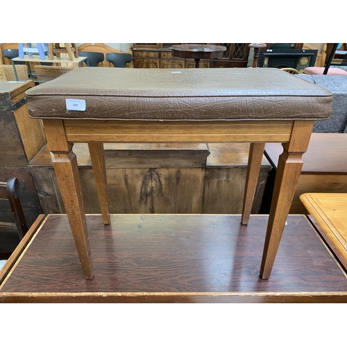 102 - A mid 20th century brown vinyl upholstered and teak piano stool