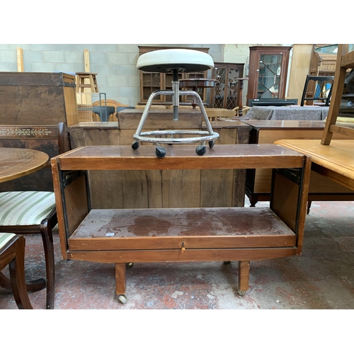 103 - Two pieces of furniture, one mid 20th century rosewood effect metamorphic tea trolley and one white ... 