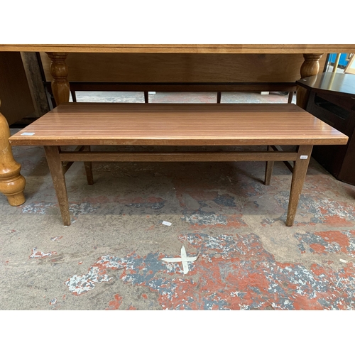 107 - A mid 20th century teak and laminate rectangular coffee table