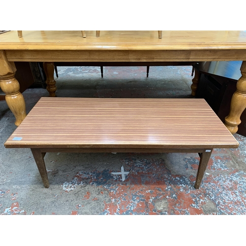 107 - A mid 20th century teak and laminate rectangular coffee table