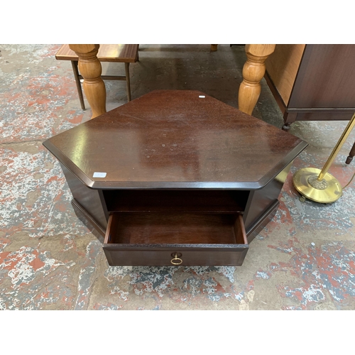 107A - A Stag Minstrel mahogany corner TV stand