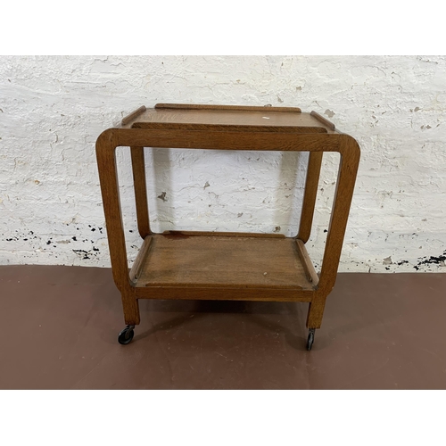 108 - An Art Deco style oak two tier tea trolley - approx. 79cm high x 38cm wide x 74cm deep