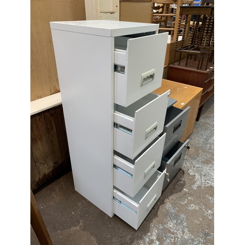 109 - Two metal office filing cabinets, one white four drawer and one grey two drawer