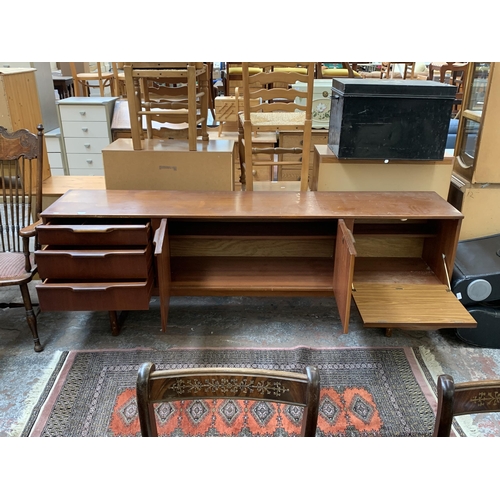 114 - A mid 20th century Stonehill Furniture Ltd teak sideboard - approx. 75cm high x 212cm wide x 44cm de... 