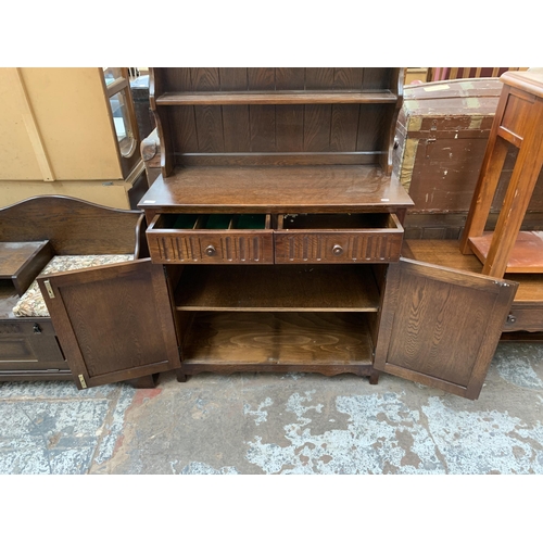 117 - A carved oak linenfold Dutch dresser - approx. 177cm high x 95cm wide x 44cm deep