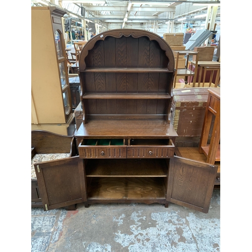 117 - A carved oak linenfold Dutch dresser - approx. 177cm high x 95cm wide x 44cm deep