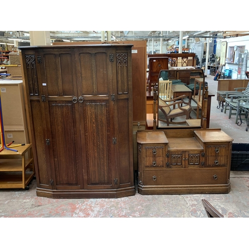 124 - A mid 20th century Crown AY Furniture carved oak linenfold two piece bedroom suite comprising double... 