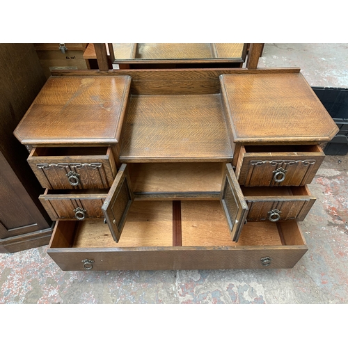 124 - A mid 20th century Crown AY Furniture carved oak linenfold two piece bedroom suite comprising double... 