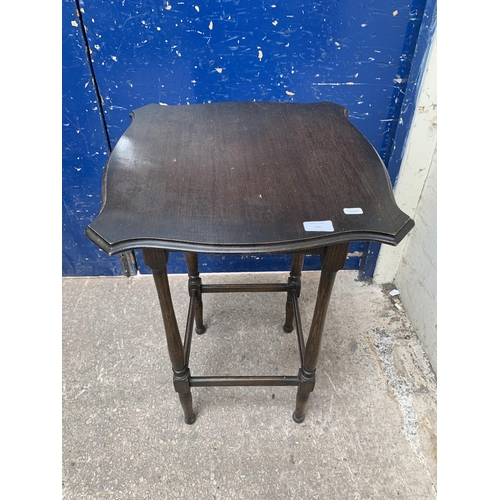 126 - An early/mid 20th century oak serpentine side table