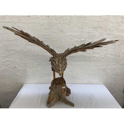 131 - A driftwood eagle sculpture - approx. 103cm high x 122cm wide