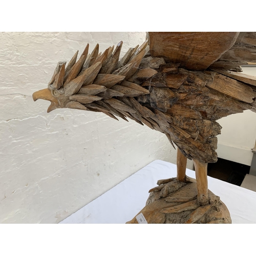 131 - A driftwood eagle sculpture - approx. 103cm high x 122cm wide