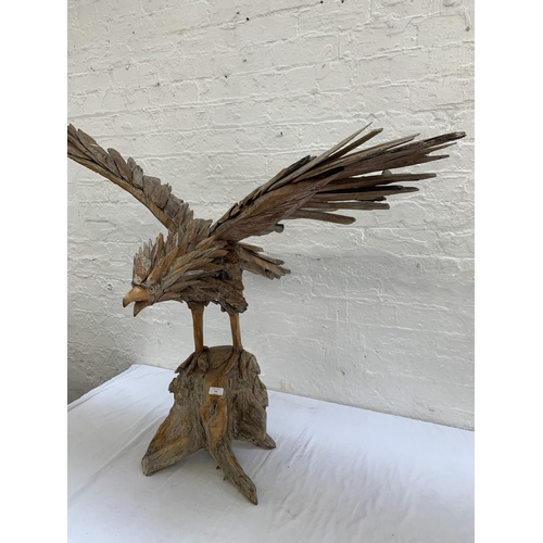 131 - A driftwood eagle sculpture - approx. 103cm high x 122cm wide