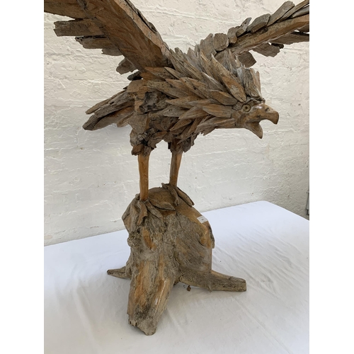 131 - A driftwood eagle sculpture - approx. 103cm high x 122cm wide