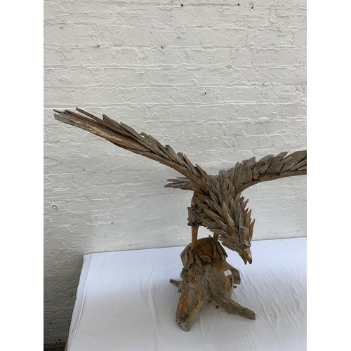 131 - A driftwood eagle sculpture - approx. 103cm high x 122cm wide