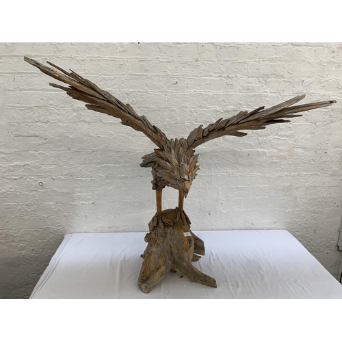 131 - A driftwood eagle sculpture - approx. 103cm high x 122cm wide