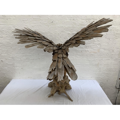 131 - A driftwood eagle sculpture - approx. 103cm high x 122cm wide