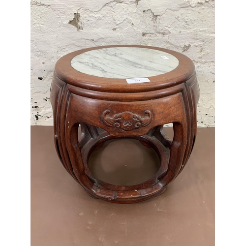 132 - A Chinese carved hardwood and marble circular side table - approx. 35cm high x 30cm diameter