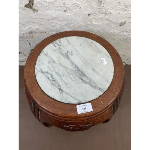 132 - A Chinese carved hardwood and marble circular side table - approx. 35cm high x 30cm diameter