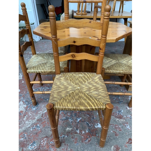 133 - A pine octagonal dining table and four rush seated chairs