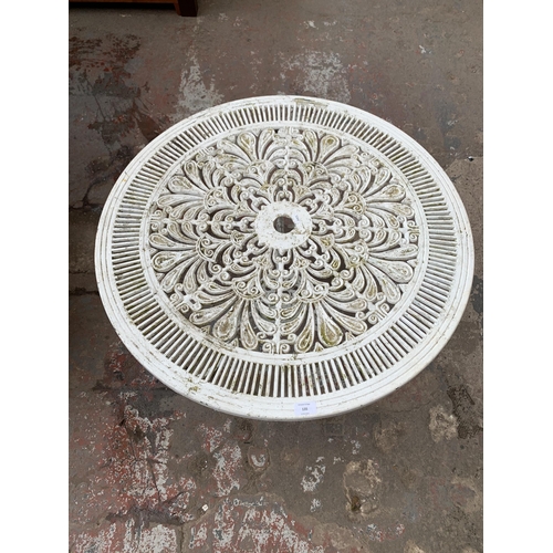 135 - A Victorian style white painted cast metal circular patio table - approx. 70cm high x 80cm diameter