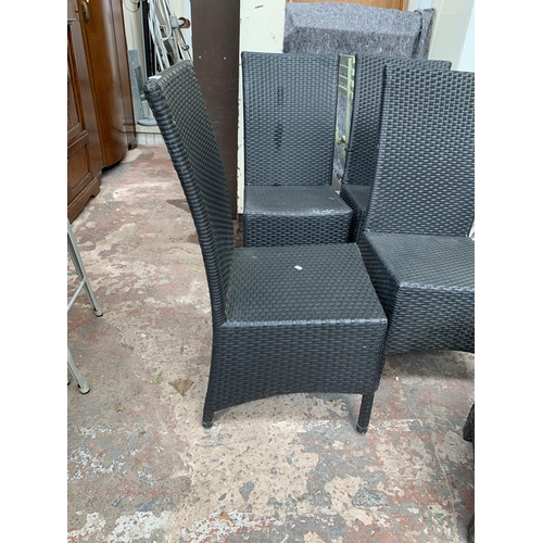 138 - Five pieces of plastic rattan effect patio furniture, four chairs and one side table