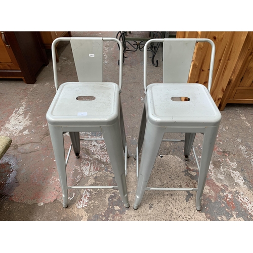 139 - A pair of industrial style metal bar stools